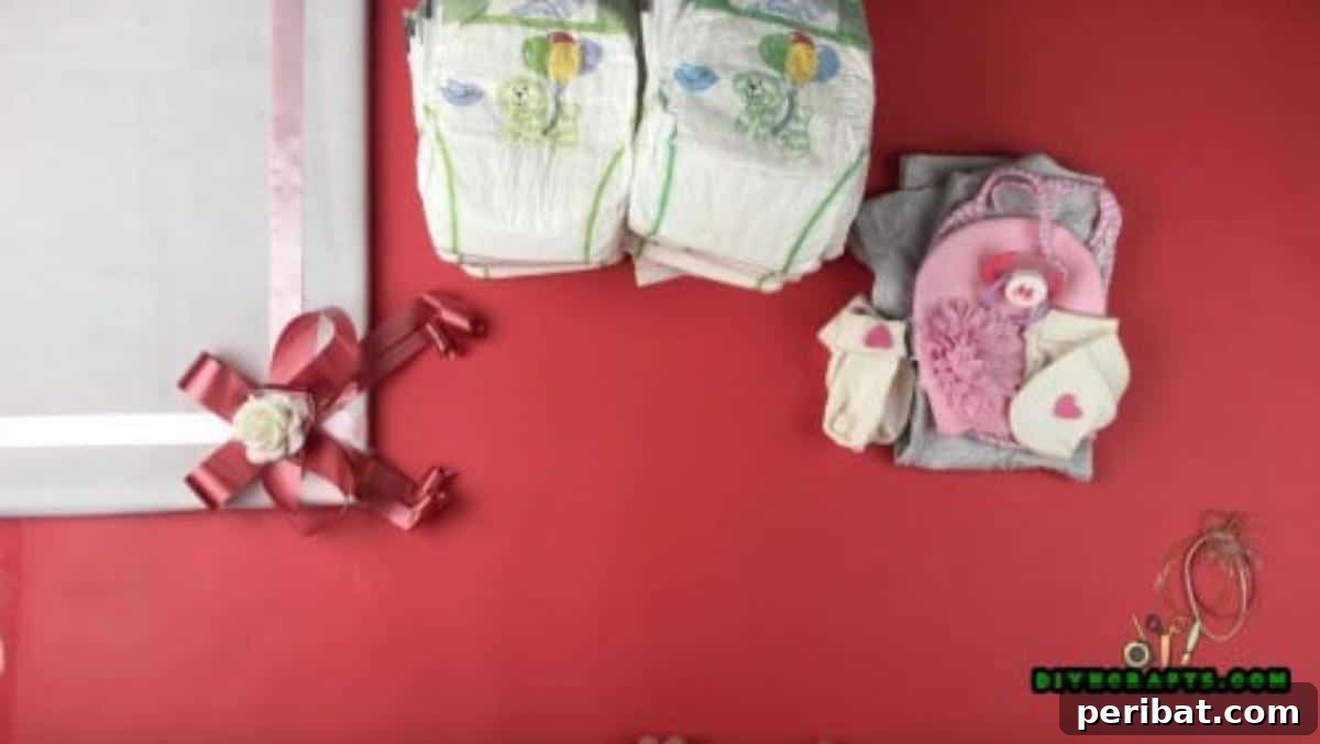 Crafting an Adorable Diaper Baby Gift 3 A flat lay photograph showcasing all the materials required to craft the diaper baby, including diapers, a pacifier, baby coverall, bib, hat, blanket, and rubber bands, all neatly arranged.