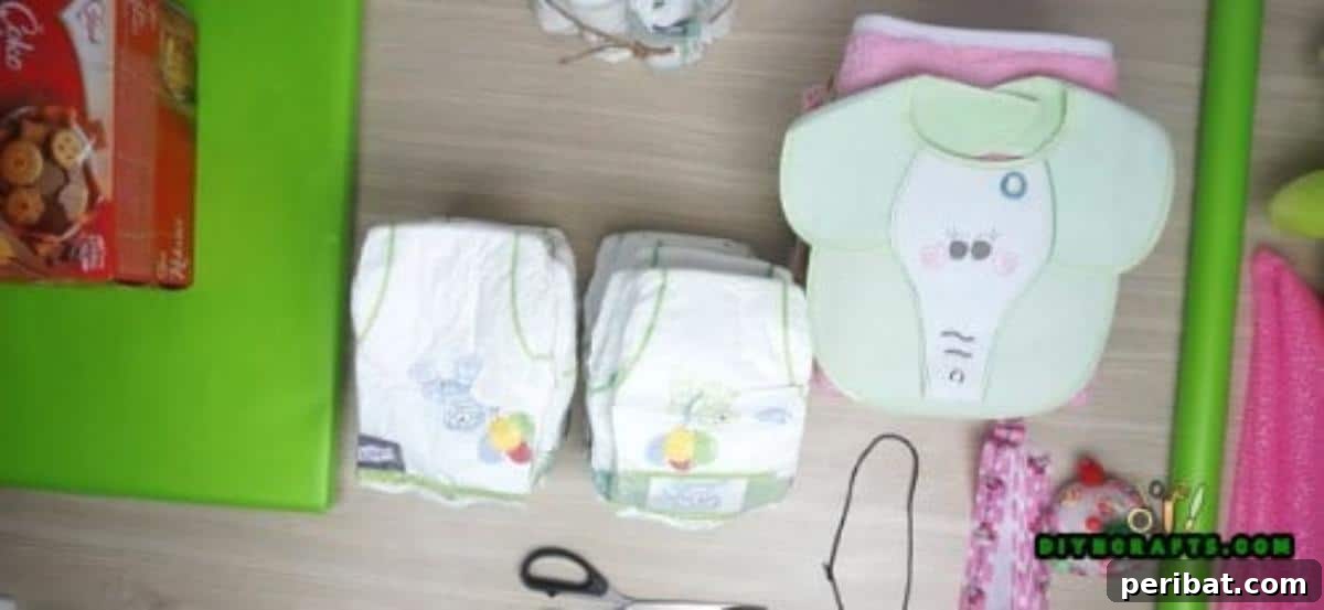 Supplies for diaper boat, including diapers, blankets, chocolates, ribbon, and toys.