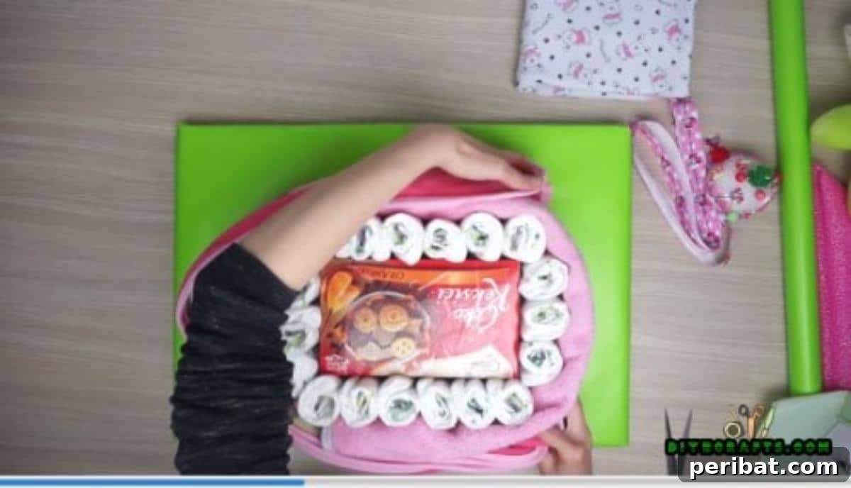 Wrap a baby blanket snugly around the entire diaper boat structure to create a smooth exterior hull.