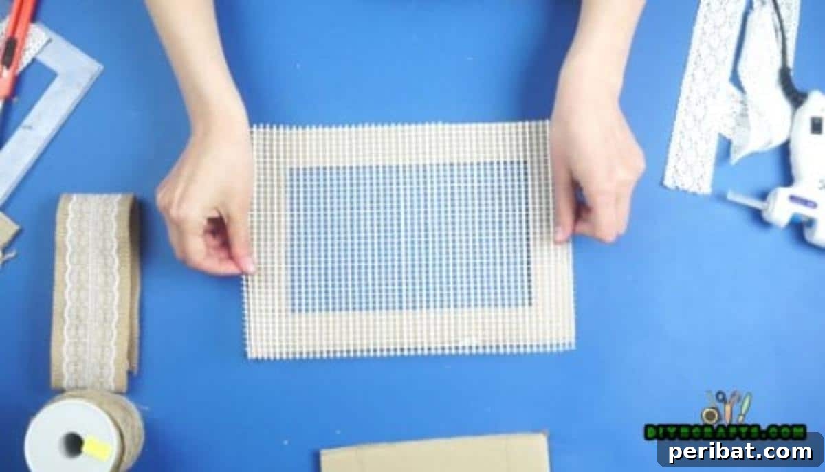 Craft Your Own Stylish Hanging Jewelry Organizer 11 Placing mesh onto glued frame, Step 3