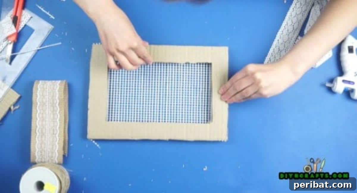 Craft Your Own Stylish Hanging Jewelry Organizer 12 Second frame being glued over mesh, Step 3
