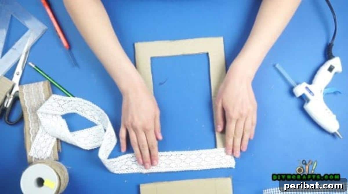 Craft Your Own Stylish Hanging Jewelry Organizer 9 Applying decorative ribbon to cardboard frame, Step 2