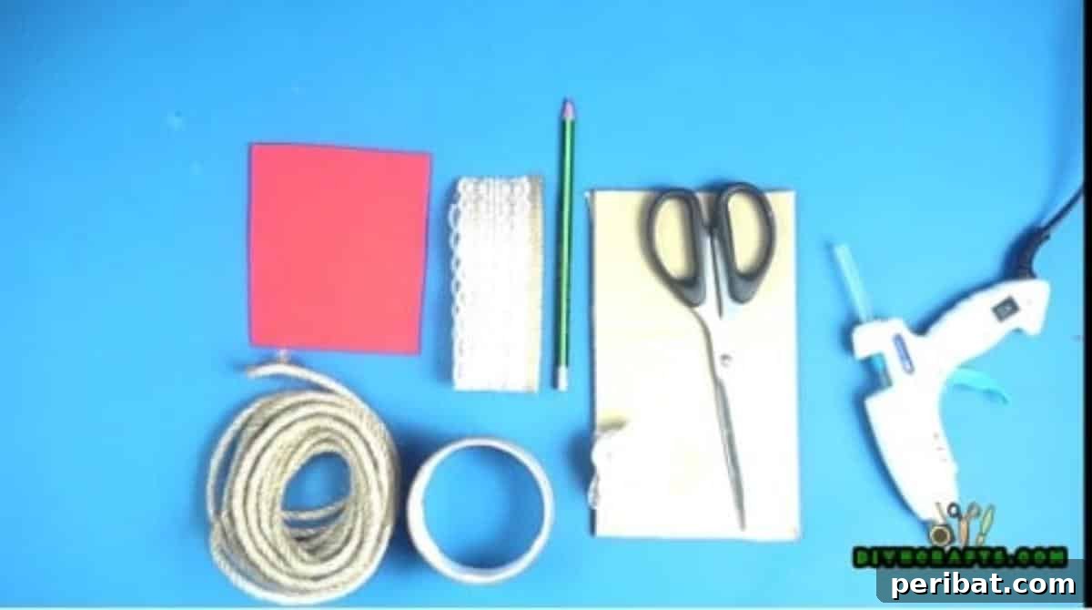 Materials for cardboard burlap jewelry holder, including a duct tape roll, scissors, glue gun, pen, burlap, colorful paper, twine, and cardboard.