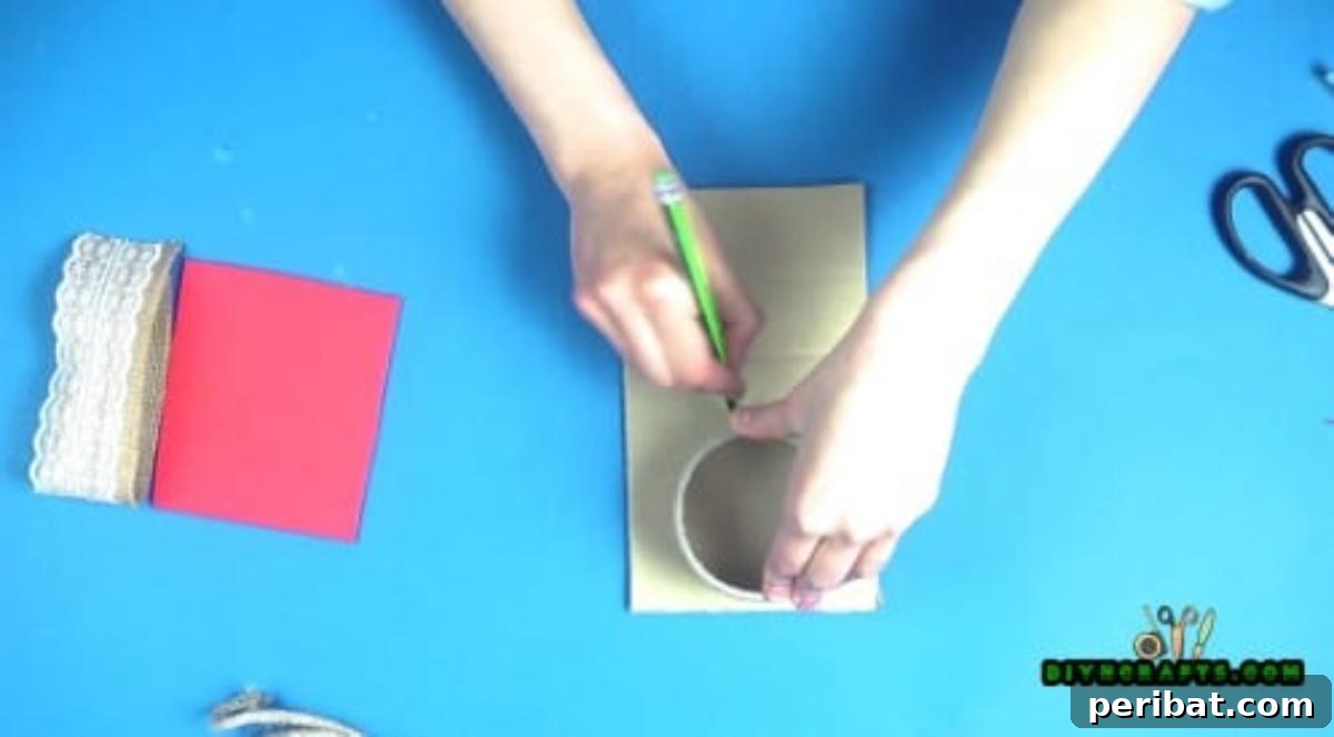 Tracing a circle onto cardboard using a duct tape roll as a template.