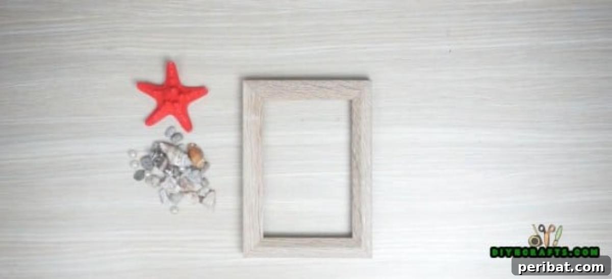 Gathering materials for a garden stone picture frame, including a wooden frame and small rocks.