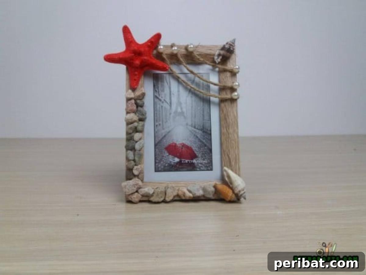 A close-up of the decorated garden stone picture frame, featuring various embellishments.