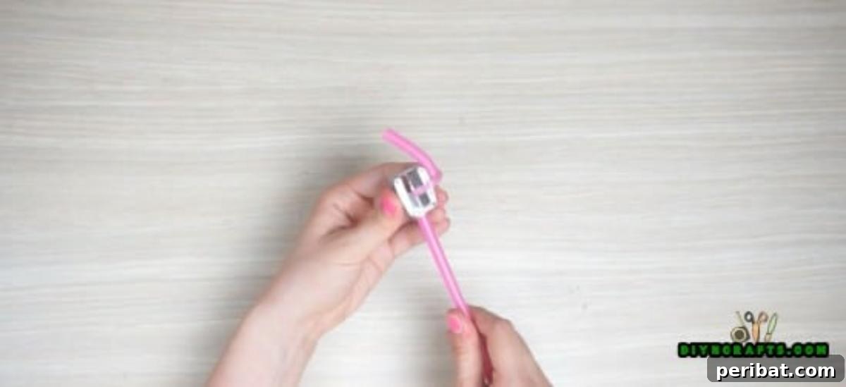 Bracelet - Step 1: Close-up of the straw spiraling out of the pencil sharpener