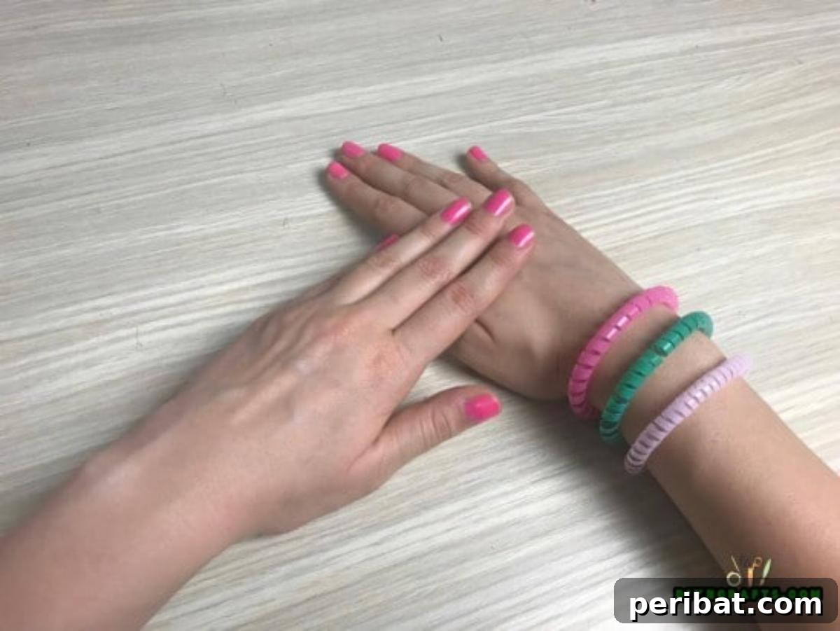 Bracelet - Step 3: Model wearing the finished spiral straw bracelet