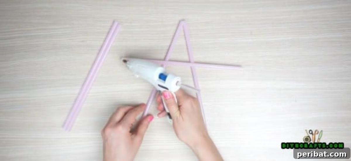 Hanging Stars - Step 1: Gluing the first two straws of the star together