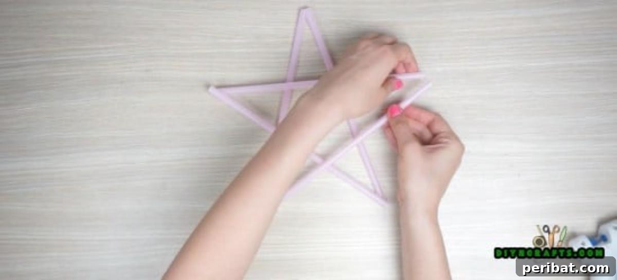 Hanging Stars - Step 1: The five-pointed straw star shape nearing completion