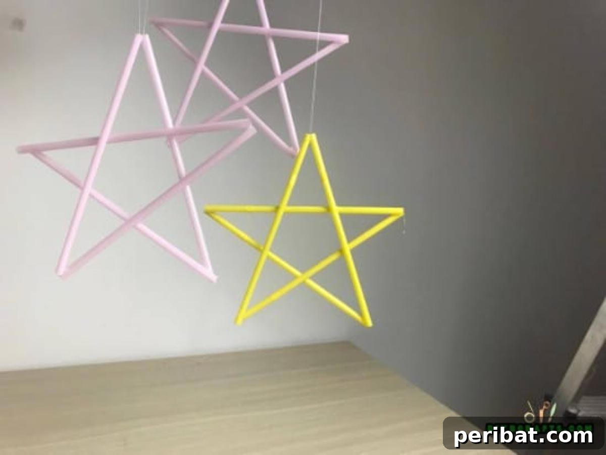 Hanging Stars - Step 2: Finished straw star with a string attached, ready for hanging