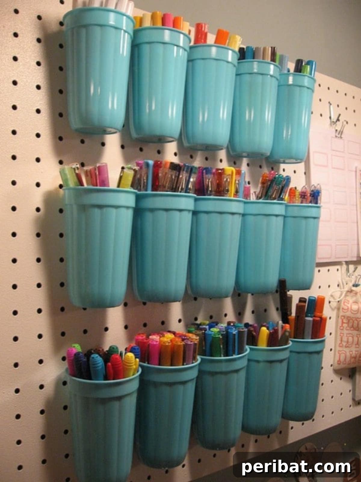 49 Creative Garage Organization Solutions 45 DIY plastic cup rack on a pegboard.