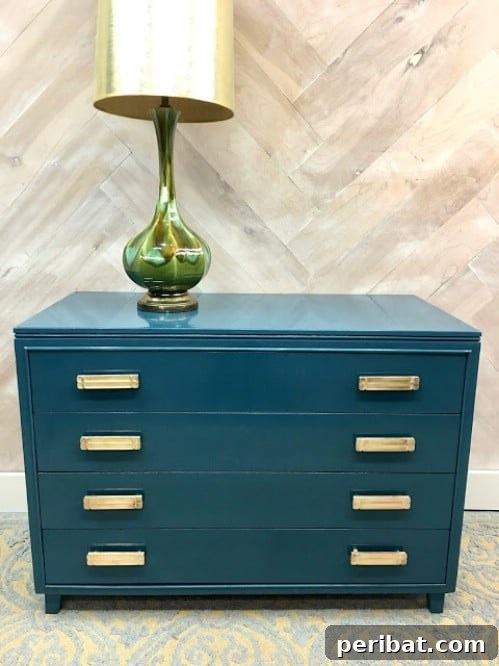 Simple yet refined teal painted dresser by Julie Peterson, showcasing elegant furniture redesign.