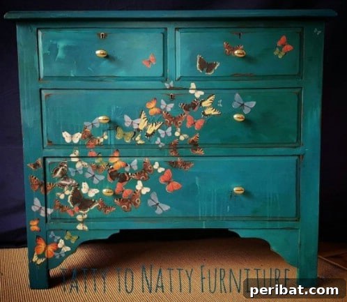 Teal painted furniture with realistic butterfly designs, showcasing teal as a perfect backdrop for intricate art.