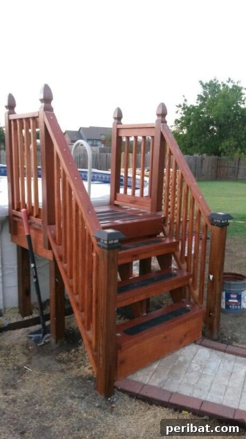 Backyard pool enhanced with a decorative and functional staircase