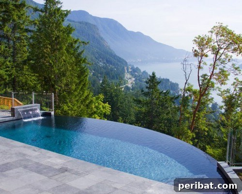 Luxury infinity pool with a stunning glass wall offering panoramic views