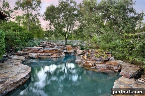 Luxurious swimming pool designed to seamlessly blend with natural surroundings