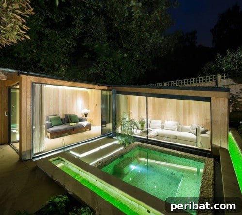Luxurious swimming pool with incredible green underwater lighting effects