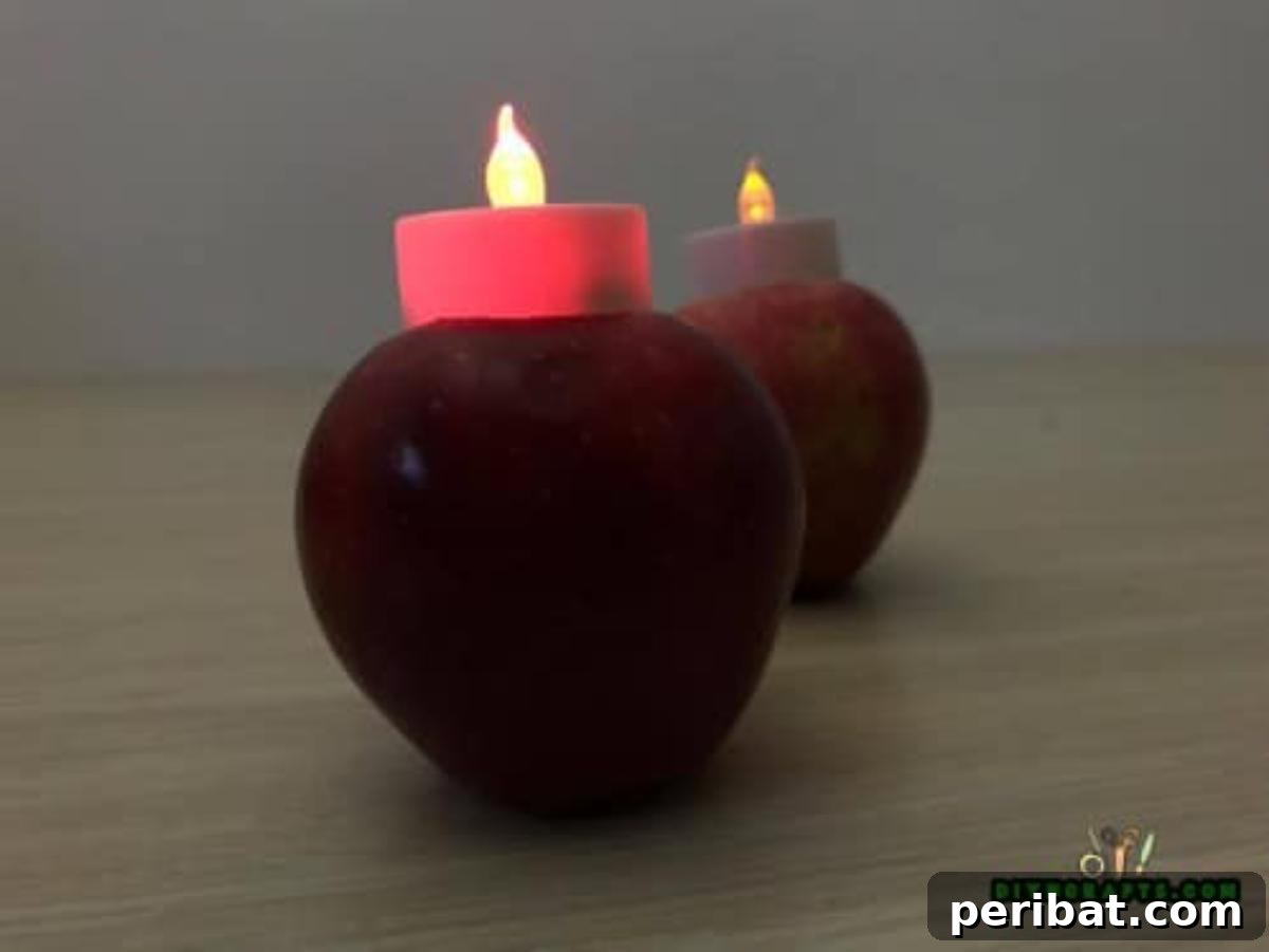 Minutes to Marvelous: 5 Easy Fall DIY Decor Projects 12 The completed apple votive, with an LED light glowing softly within the hollowed apple, creating a beautiful and safe centerpiece for autumn.