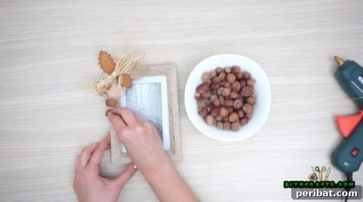 Minutes to Marvelous: 5 Easy Fall DIY Decor Projects 5 Carefully gluing natural acorns around the edges of the picture frame, creating a rustic and complete fall border design.