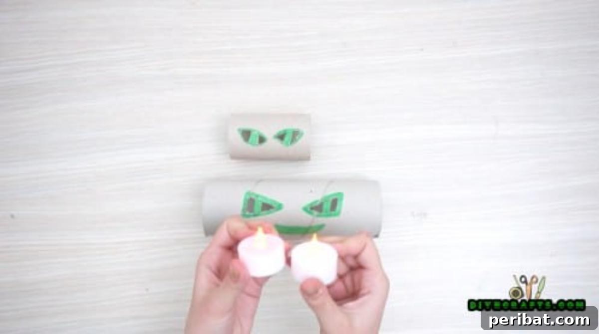 Step 4: Inserting LED tea lights into the cut-out toilet paper rolls, ensuring safe and heat-free illumination.