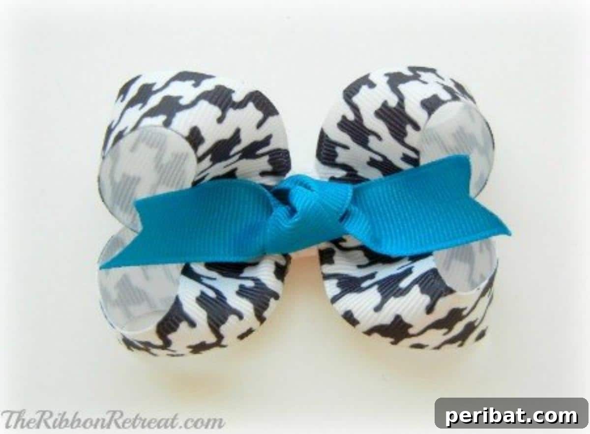Sophisticated Twisted Boutique Bow crafted from wide ribbon, featuring elegant loops and a polished finish.