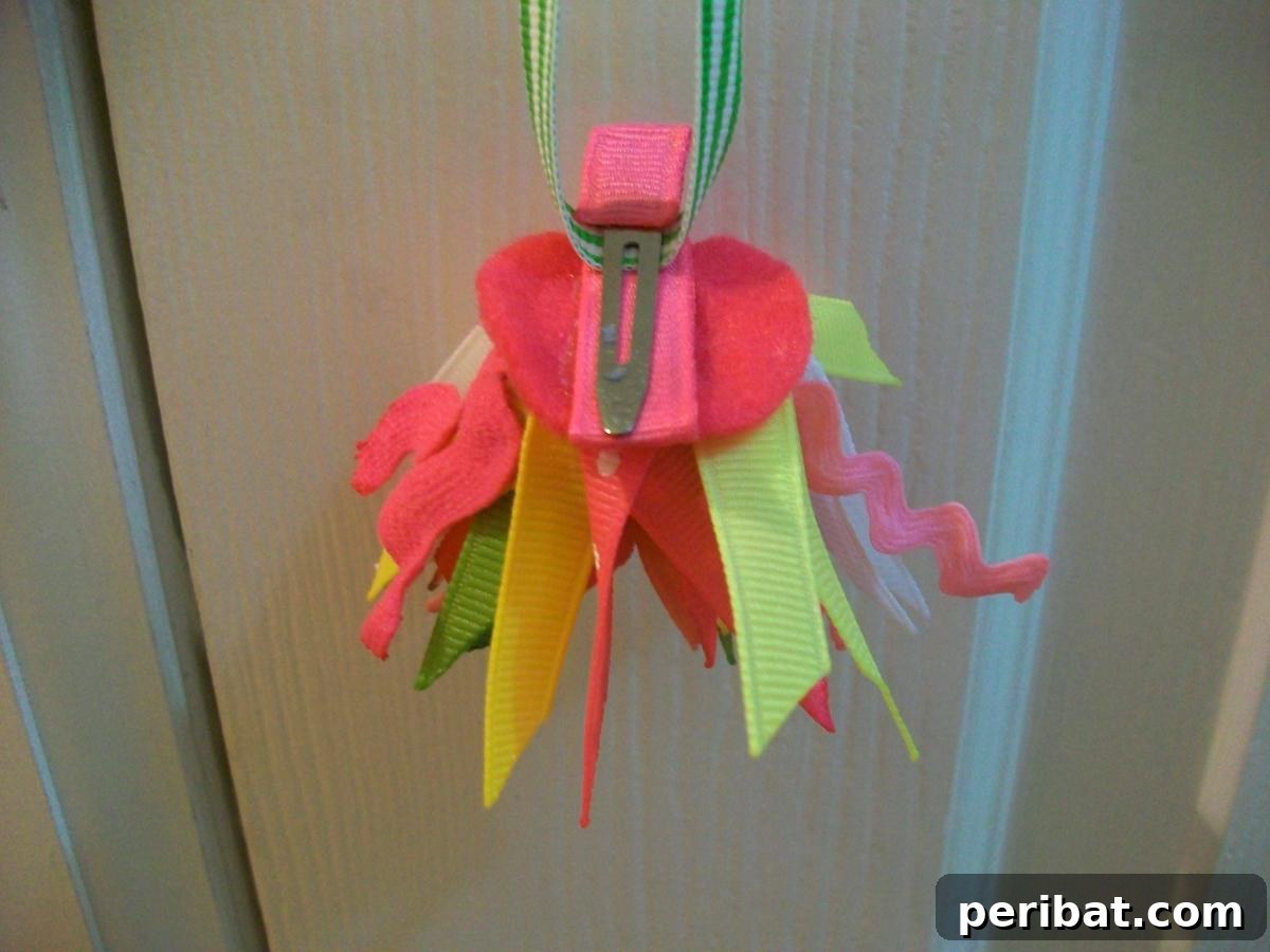Energetic Spikey Pom Pom Bow, featuring ribbon, ric rac, and felt arranged in a fun, textured, and spiky design.