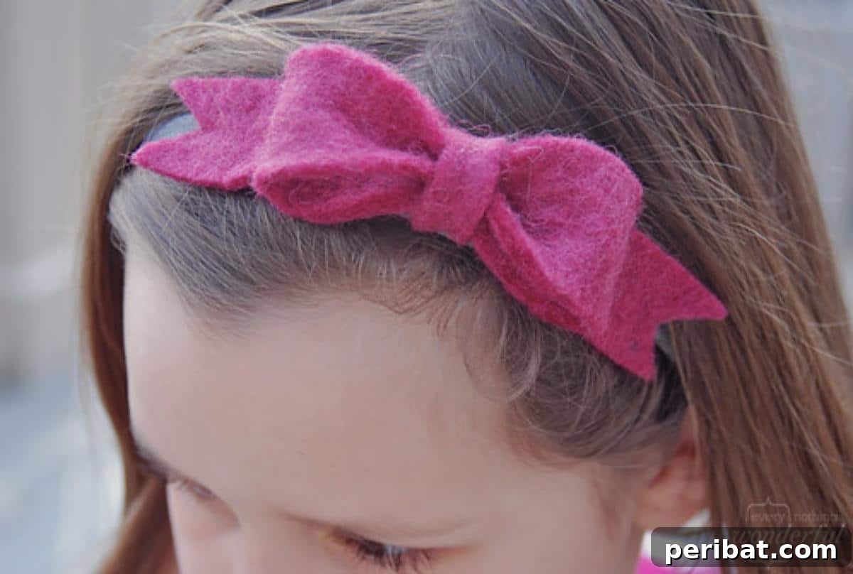 Soft Felt Bow, simply folded and cinched in the middle, perfect for a cozy and rustic hair accessory.