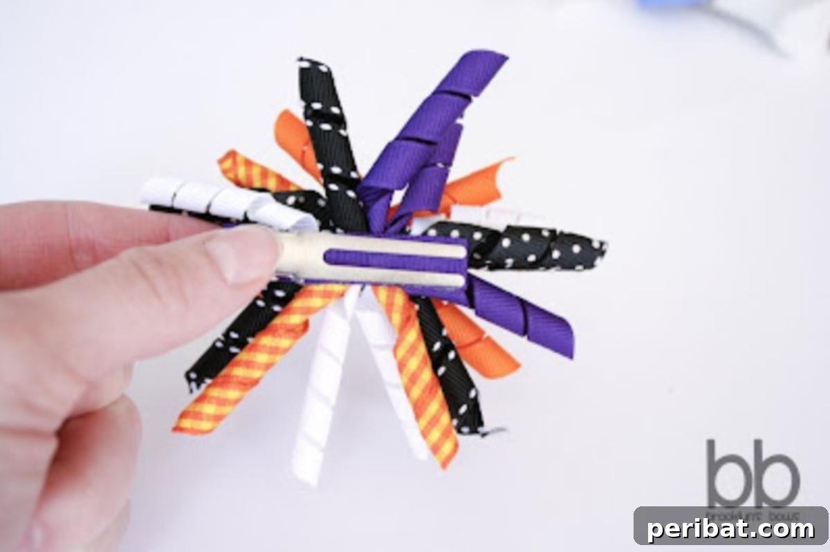 Fun Halloween Korker Bows with curly ribbons in festive orange, black, and purple colors.