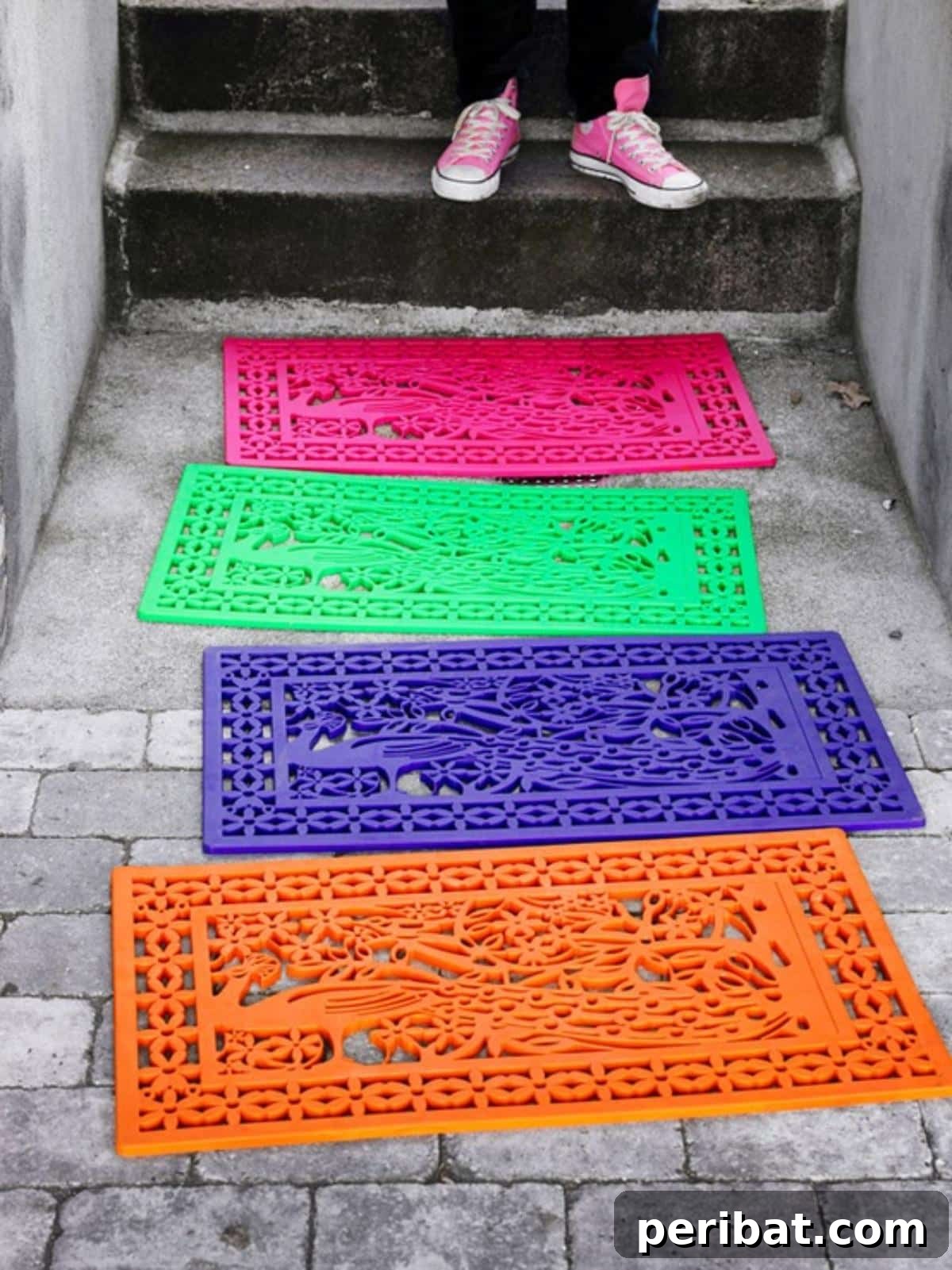 A rubber doormat transformed with a bright, multi-colored spray paint 'color splash' effect, adding a cheerful touch.