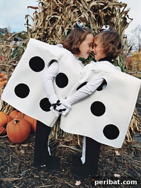 75 Effortless DIY Halloween Costumes That Kids Adore 21 Two children dressed as 'Dice' for Halloween, a clever and easy DIY costume idea for twins or siblings