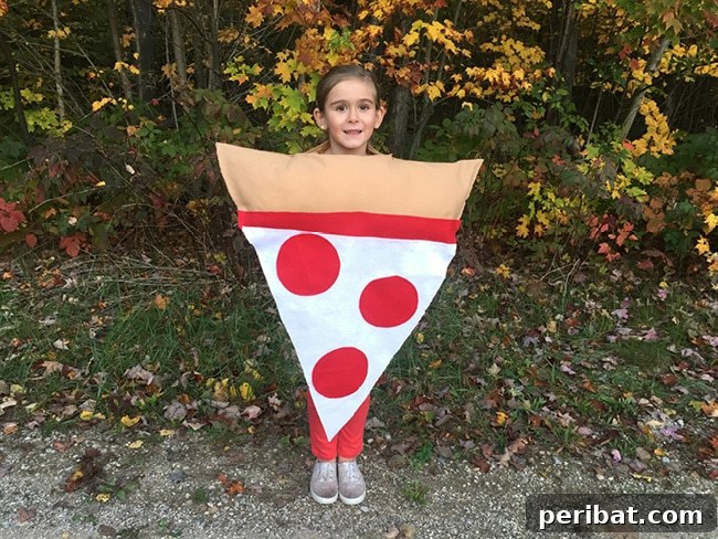 75 Effortless DIY Halloween Costumes That Kids Adore 4 A happy girl showcasing an easy, no-sew DIY pizza Halloween costume outdoors, featuring classic pepperoni toppings