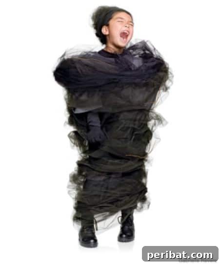 75 Effortless DIY Halloween Costumes That Kids Adore 36 A child in a dramatic 'Tornado' costume for Halloween, featuring a swirling design and miniature houses