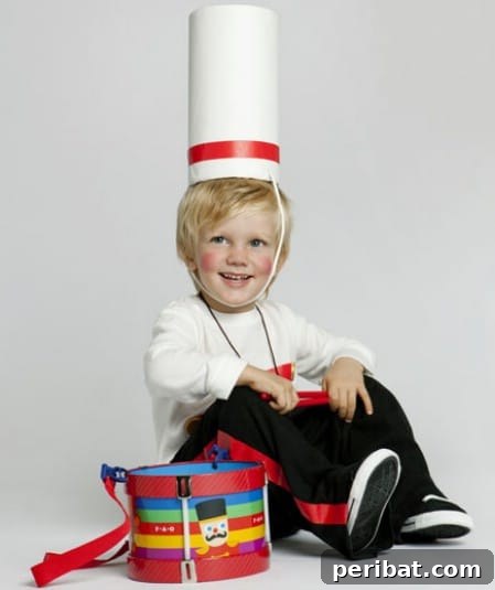 75 Effortless DIY Halloween Costumes That Kids Adore 44 A child dressed as a 'Little Drummer Boy' for Halloween, featuring a homemade uniform and drum, a creative DIY costume