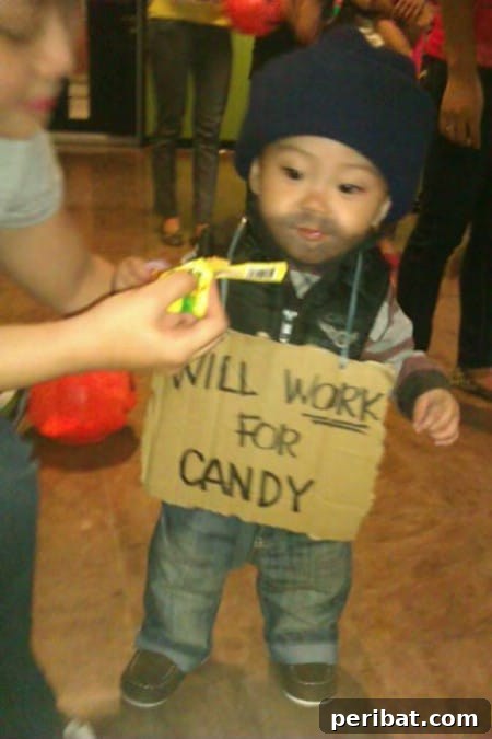 75 Effortless DIY Halloween Costumes That Kids Adore 45 A child dressed as a 'Bum' for Halloween, featuring torn clothing, a ski cap, and a cardboard sign, a classic DIY costume