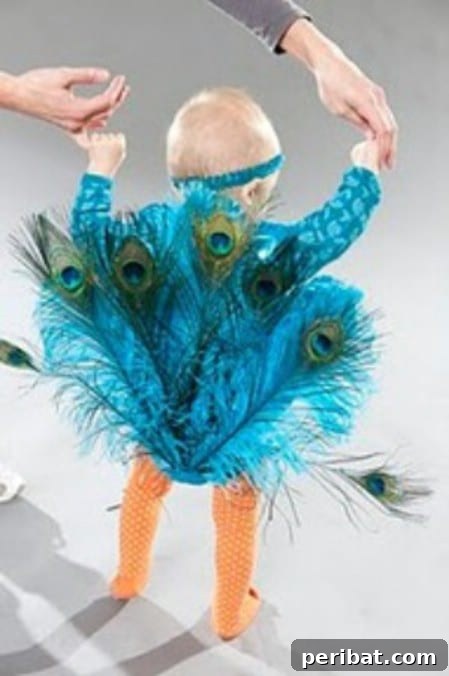 75 Effortless DIY Halloween Costumes That Kids Adore 47 A baby in a beautiful 'Baby Peacock' costume, featuring an aqua onesie adorned with peacock feathers and a feathered headband, a stunning DIY costume