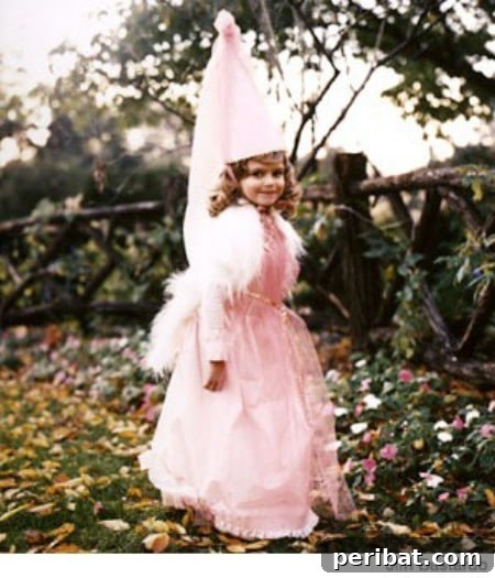 75 Effortless DIY Halloween Costumes That Kids Adore 62 A child in an enchanting 'Enchanted Princess' costume for Halloween, featuring table skirting and tulle, a no-sew DIY idea