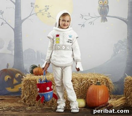 75 Effortless DIY Halloween Costumes That Kids Adore 69 A child in an inspiring 'Astronaut' costume for Halloween, featuring white sweats, tennis shoes, insignias, and a helmet made from a hooded sweatshirt, an easy DIY idea