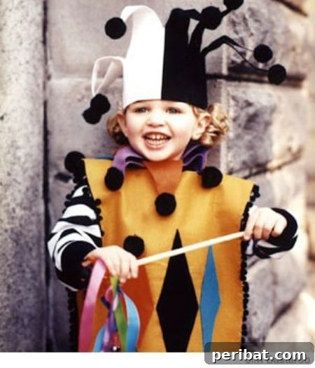 75 Effortless DIY Halloween Costumes That Kids Adore 70 A child in a vibrant 'Court Jester' costume for Halloween, featuring felt, pom-poms, ribbon, and jingle bells, a colorful DIY idea