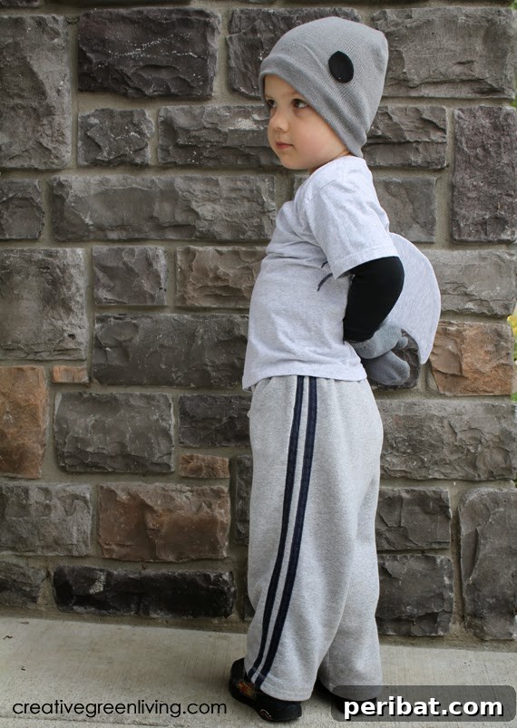75 Effortless DIY Halloween Costumes That Kids Adore 10 A boy enthusiastically wearing a super easy DIY shark costume, perfect for Halloween adventures