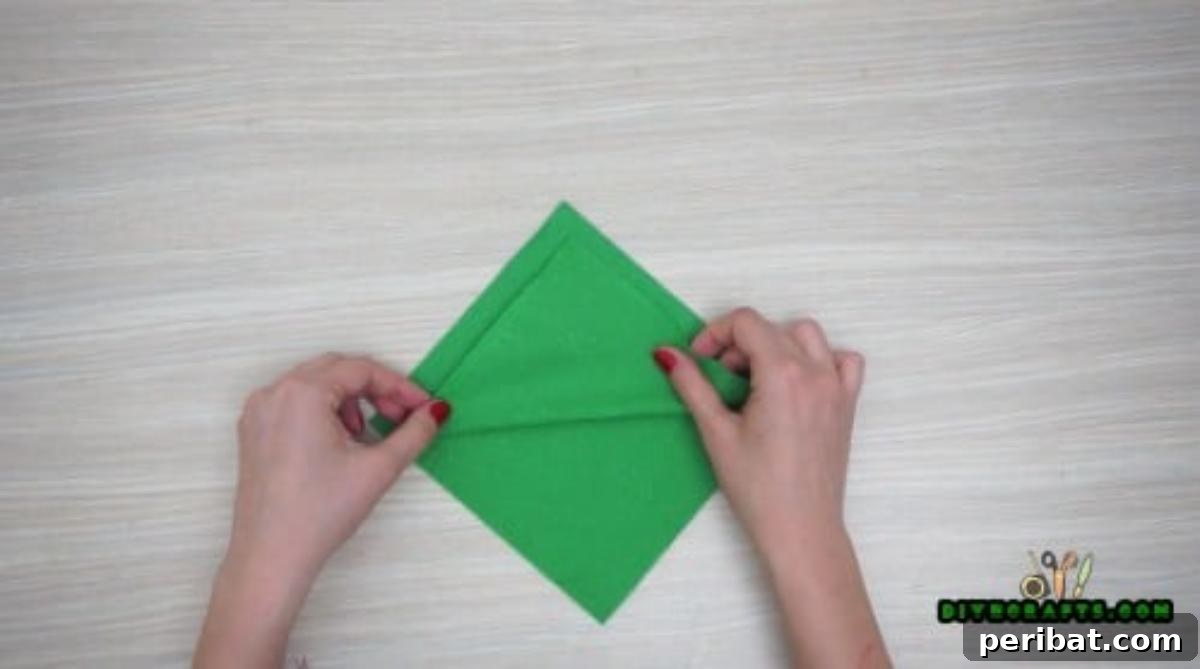 5 DIY Christmas Napkin Designs: Festive Folds, Easy Video How-To 10 Tree Napkin - Fold napkin layers to create Christmas tree tiers, a beautiful DIY table setting.