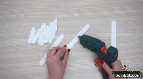 Effortless Holiday Crafting 5 DIY Ornament Videos 31 Prepare craft sticks by cutting some at a diagonal angle