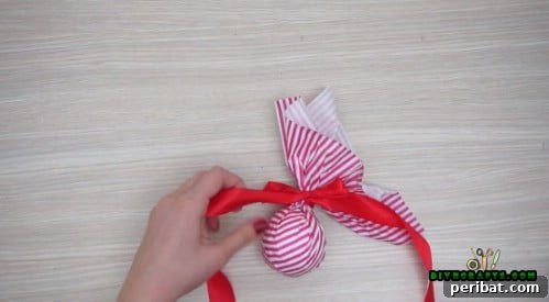 Effortless Holiday Crafting 5 DIY Ornament Videos 42 Tie a ribbon around the gathered tissue paper