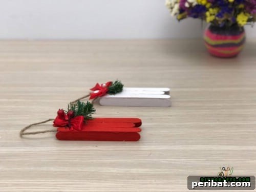 Effortless Holiday Crafting 5 DIY Ornament Videos 10 Finished Christmas sleigh ornament with twine hanger