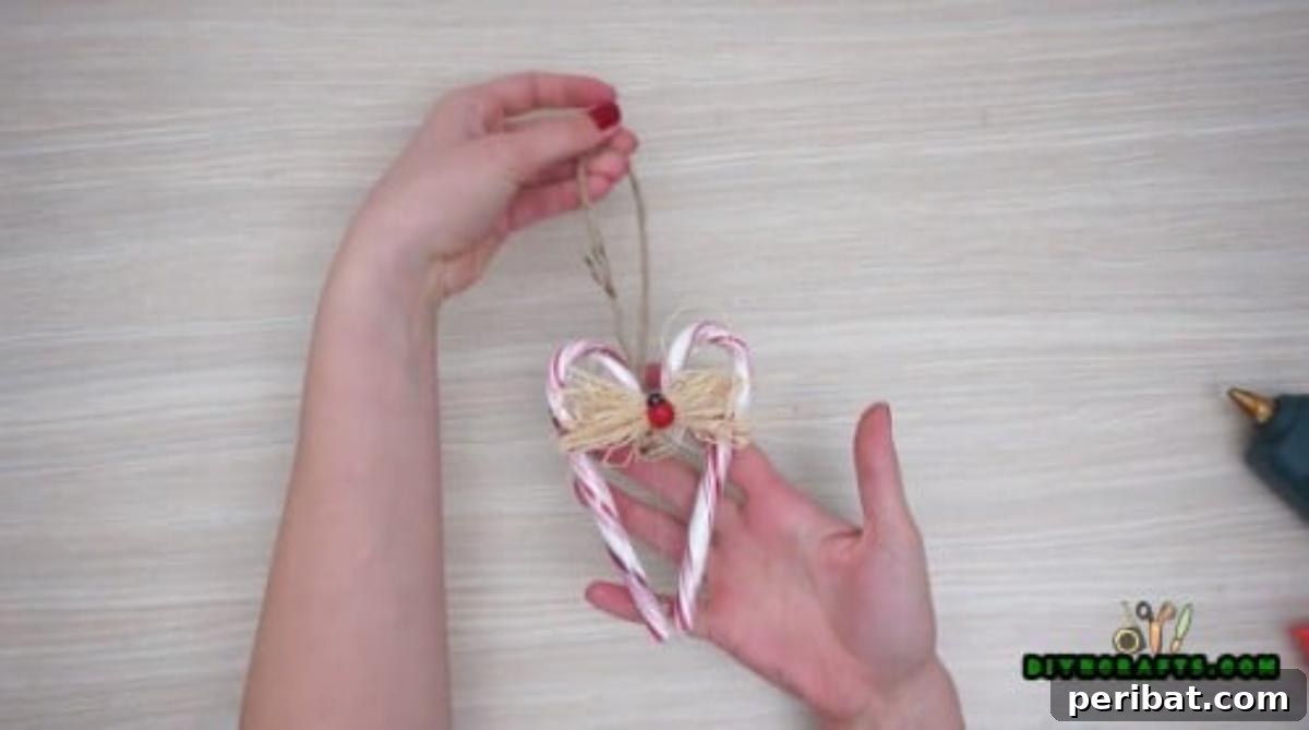 5 Festive Candy Cane Crafts to Sweeten Your Christmas 11 Candy Cane Heart Ornament - 5 Candy Cane Projects for a Deliciously Festive Christmas