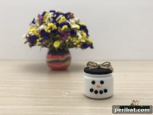 5 Frugal & Festive Christmas Jar Decorations 14 Step 3: Decorate the snowman jar with additional embellishments like a scarf, hat, or glitter.