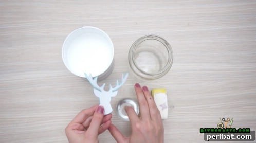 5 Frugal & Festive Christmas Jar Decorations 4 Step 1: Attach a reindeer head cutout as a stencil to the side of a glass jar.