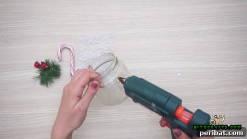 5 Frugal & Festive Christmas Jar Decorations 24 Step 1: Glue lace around the side of a clean glass jar.