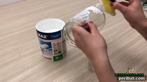 5 Frugal & Festive Christmas Jar Decorations 5 Step 2: Use a sponge to carefully apply white paint over the entire surface of the jar, avoiding the cutout.