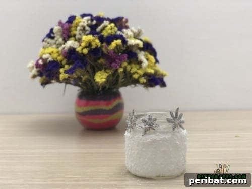 5 Frugal & Festive Christmas Jar Decorations 37 Step 5: The finished whimsical snow jar, glowing with interior light, creating a magical winter scene.
